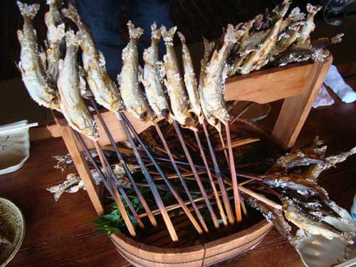 Ayu sweetfish grilled over charcoal in Japan.