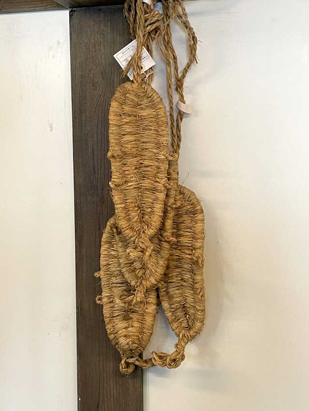 Straw sandals.