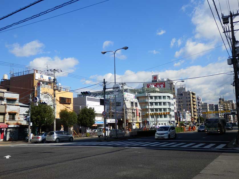 The wide street separating Shinsekai from Kamagasaki is known for cheap hotels.