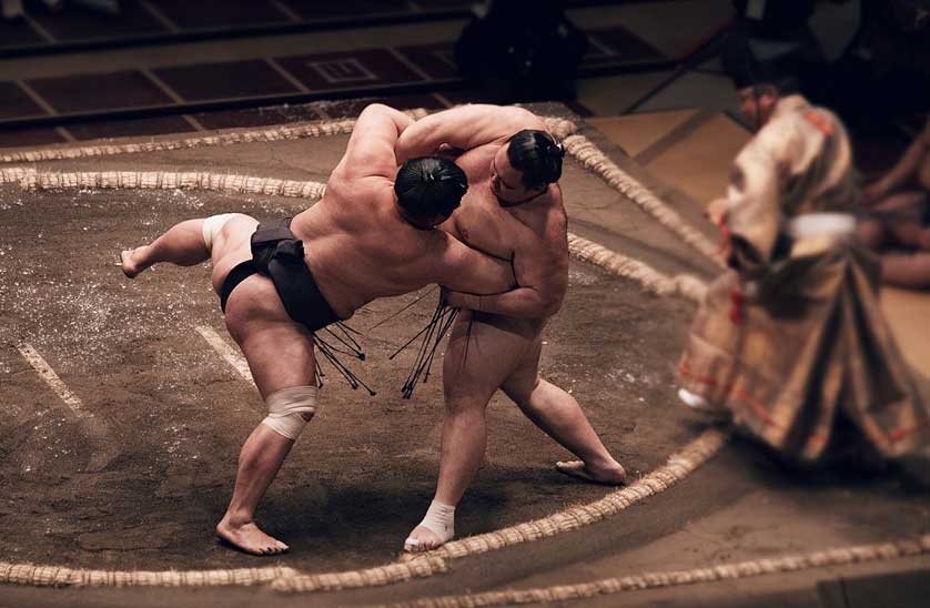 Sumo wresters in a dohyo (ring).